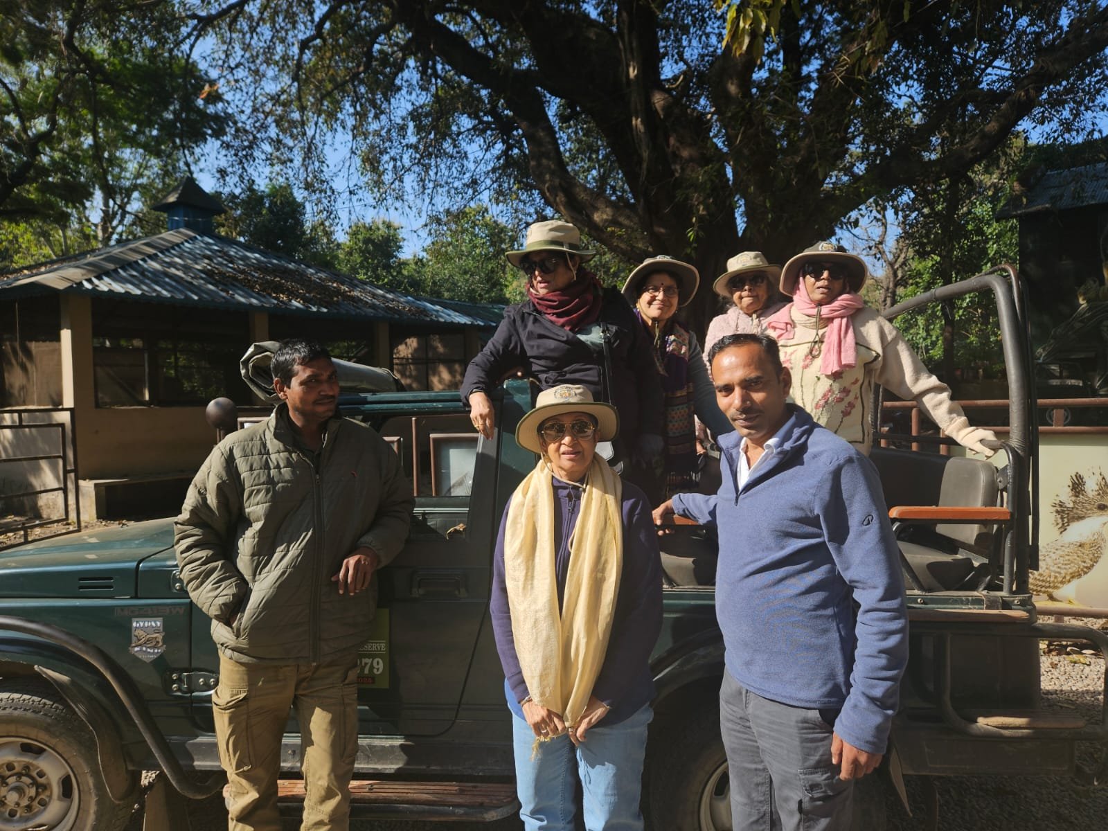 Corbett Package Tour guests beside their safari jeep in Jim Corbett National Park